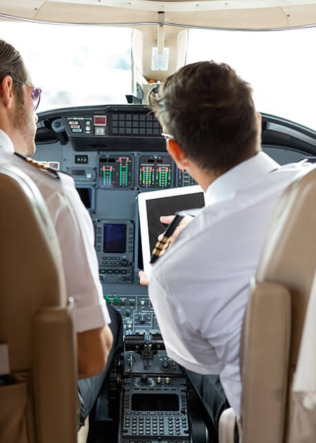 Co-Pilot showing instructions on a tablet to a Pilot